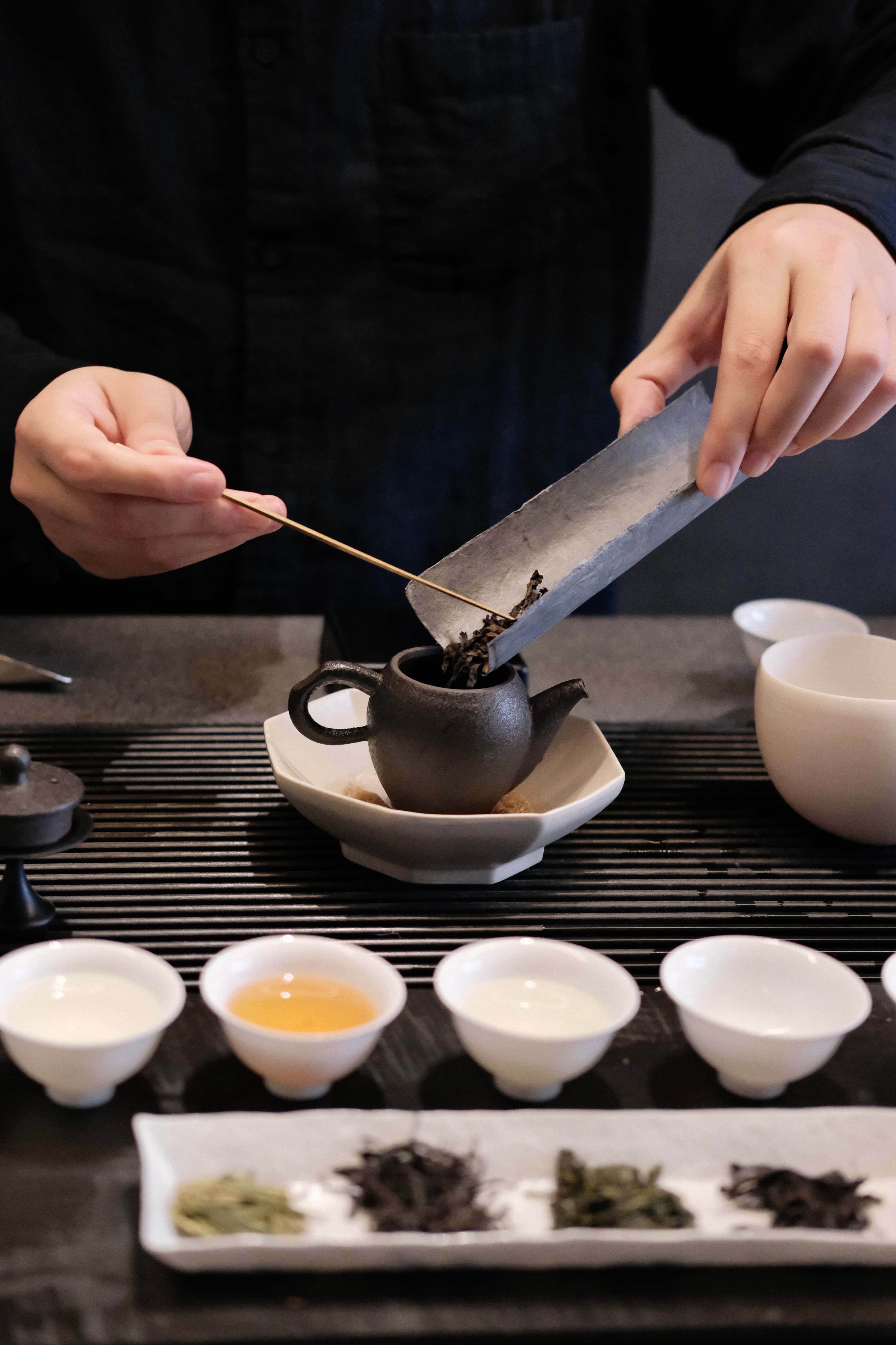 Tea host preparing tea.